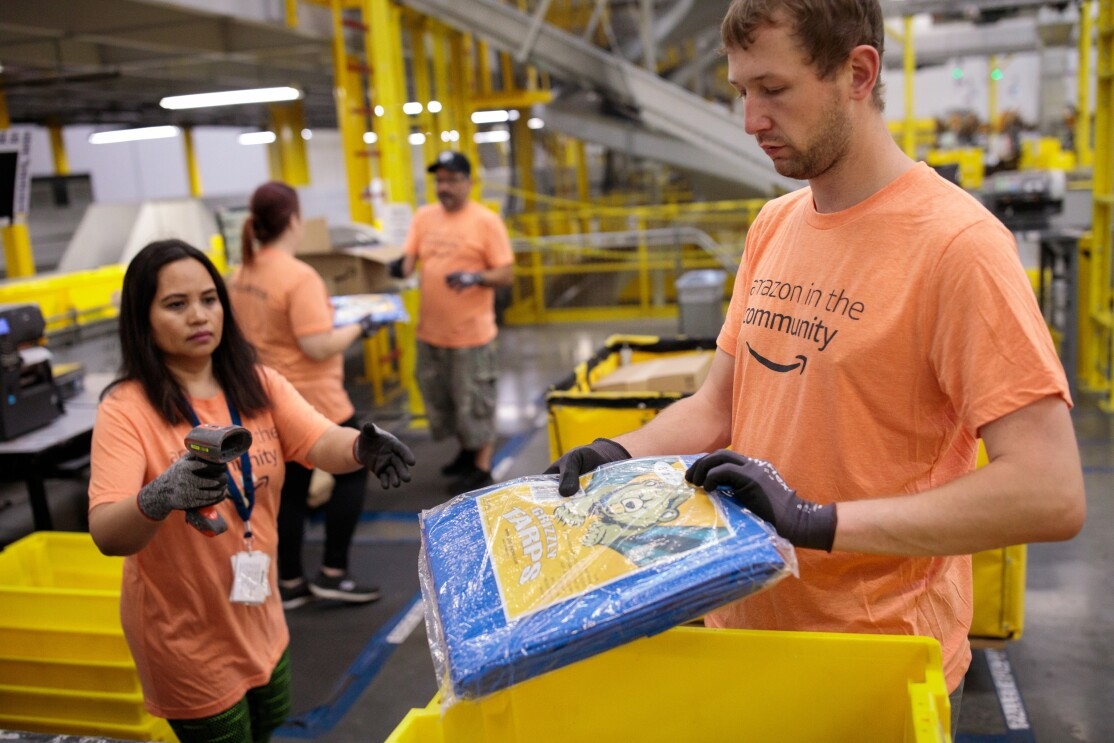 Amazon associates prepare tarps and other products for those impacted by Hurricane Dorian.