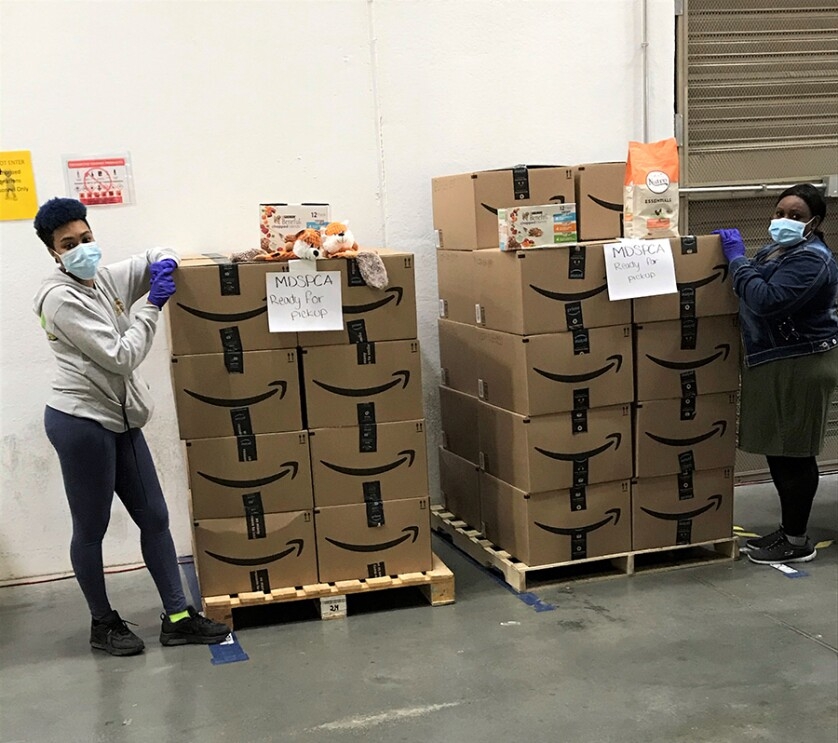 Images from the ASPCA in thanks to Amazon for donating thousands of items, including 6,500 pounds of pet food 