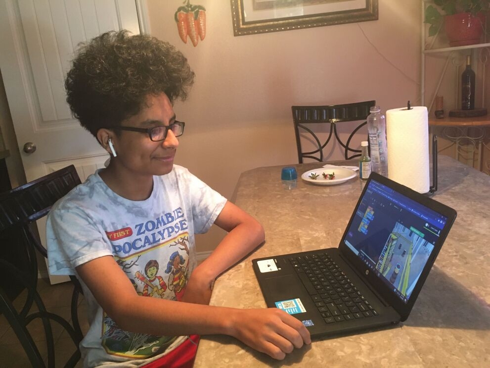 Amazon Future Engineer student learning computer science skills from home.