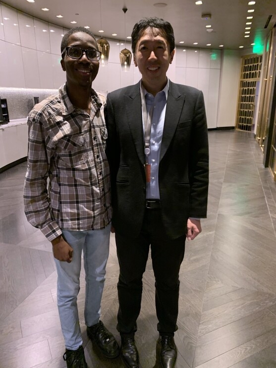 A teen (Leo Jean Baptiste) stands next to Standard professor and re:MARS keynote speaker, Andrew Ng.