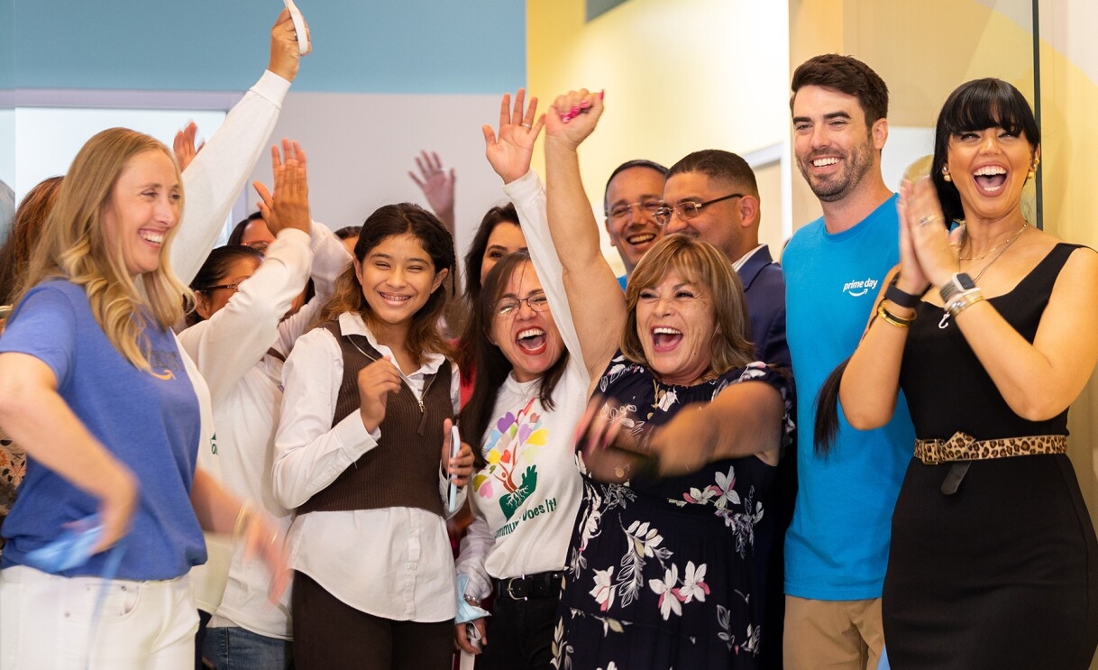 Amazon employees surprise nonprofits and schools with donations of various items.