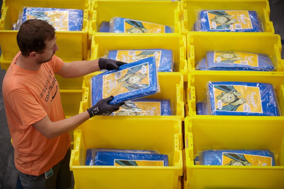 Amazon associates prepare items to distribute in the aftermath of Hurricane Dorian.