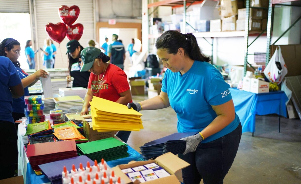 Amazon employees surprise nonprofits and schools with donations of various items.