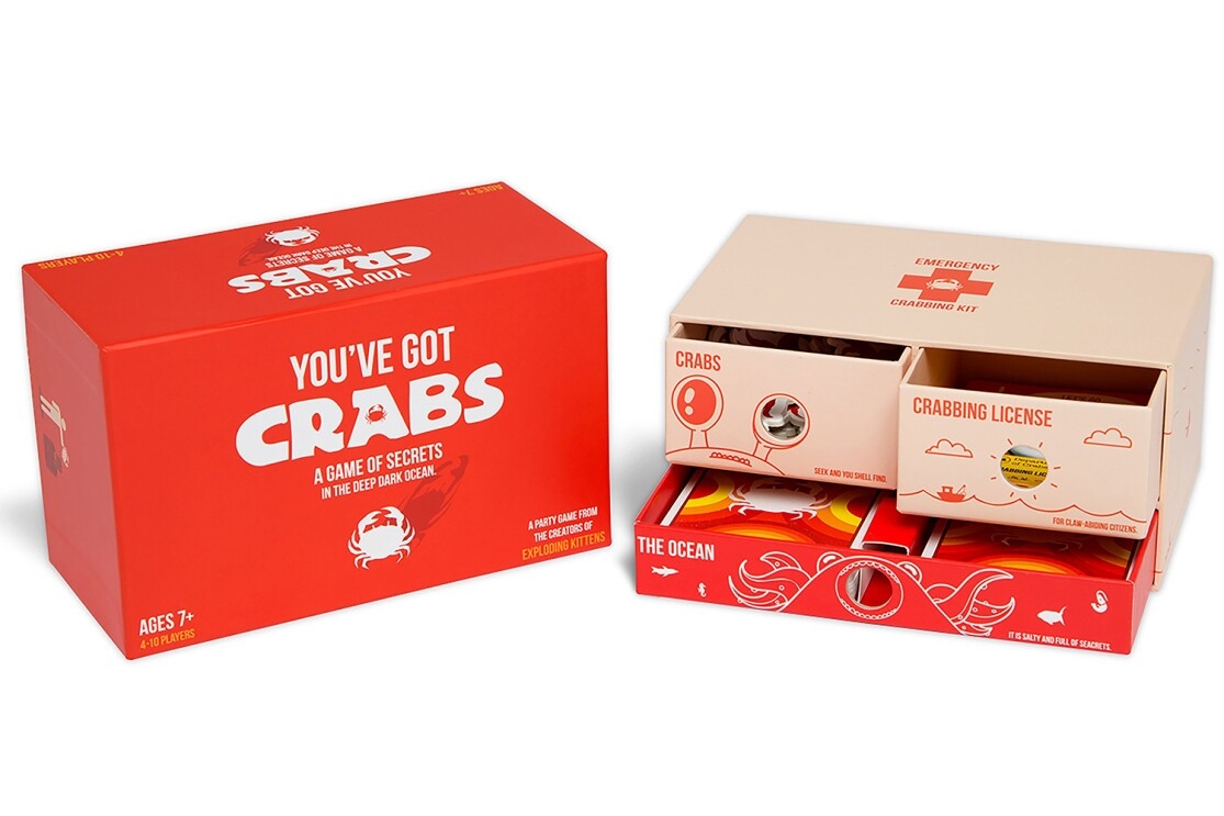 A family-friendly party game called You've Got Crabs, which includes 78 cards, instructions, foam turn indicator, 28 crab points and a box with 3 drawer compartments