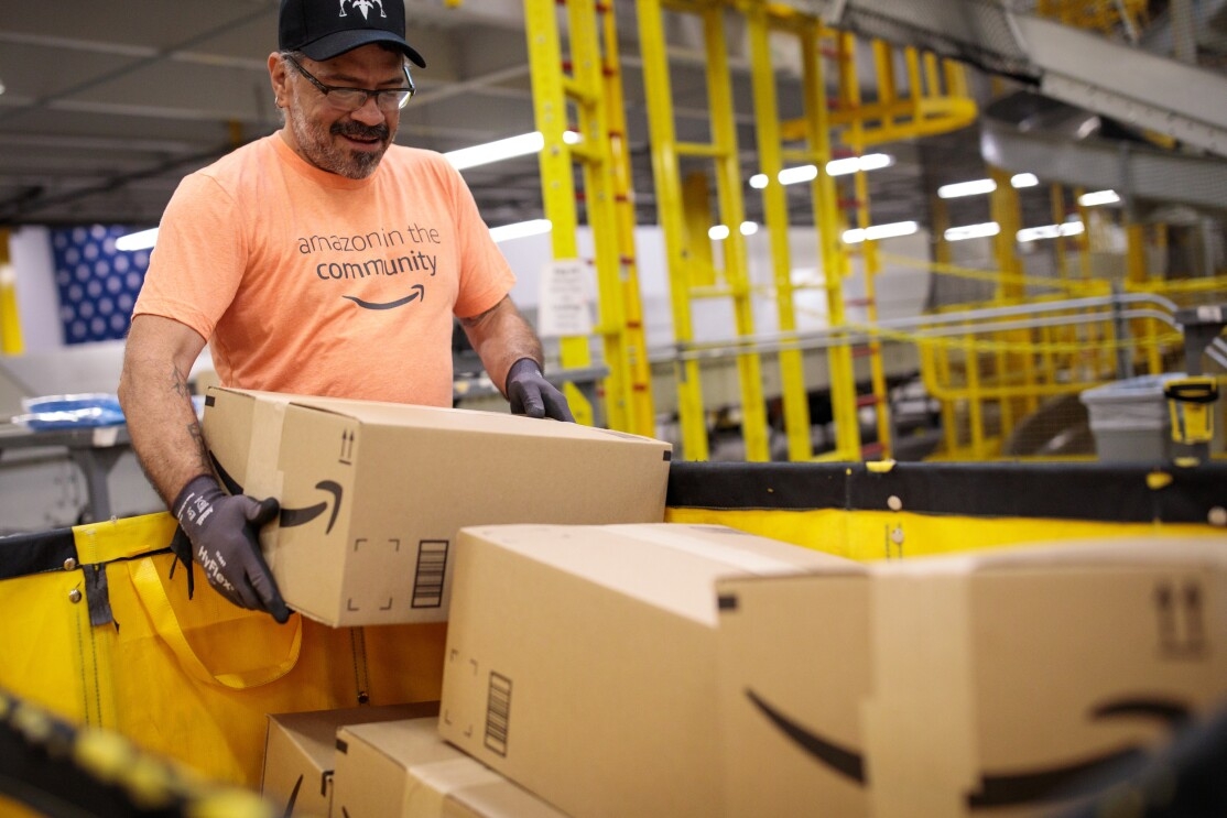 Amazon associates prepare items to distribute in the aftermath of Hurricane Dorian.