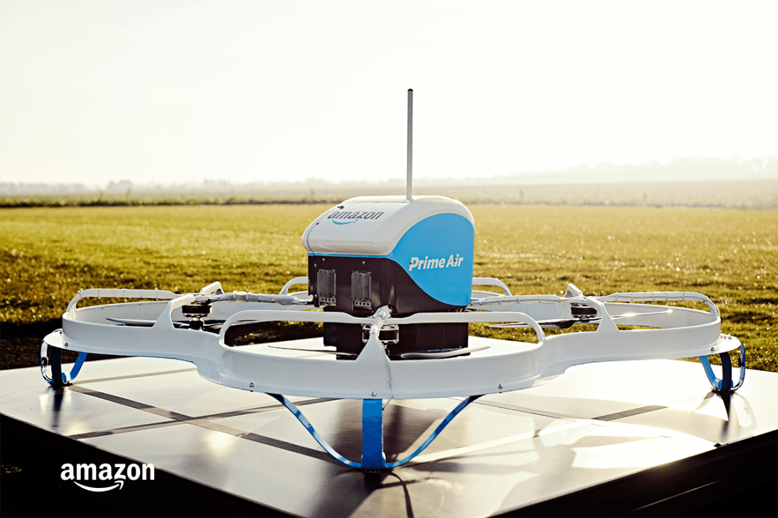 The Amazon Prime Air MK21 octocopter is parked on a base outside.