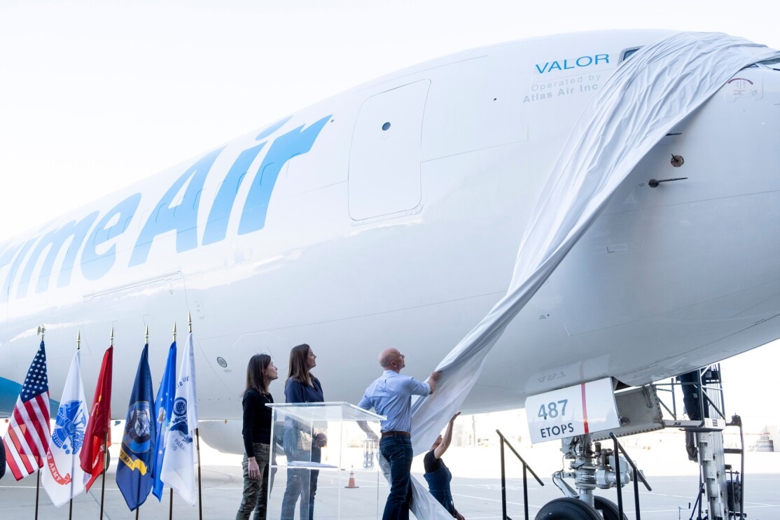 Jeff Bezos unveils the name of a new Prime Air plane, "Valor" at an event to announce the plane on Veterans Day.