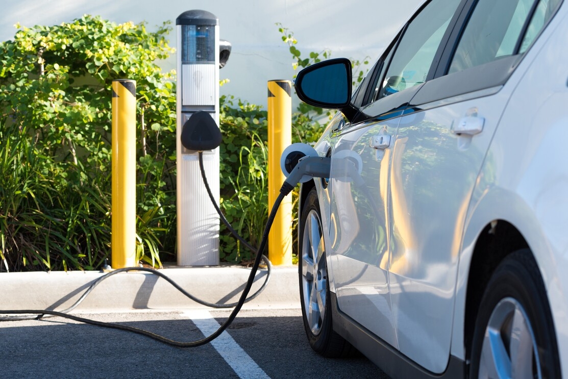 A vehicle being charged at an electric charging station