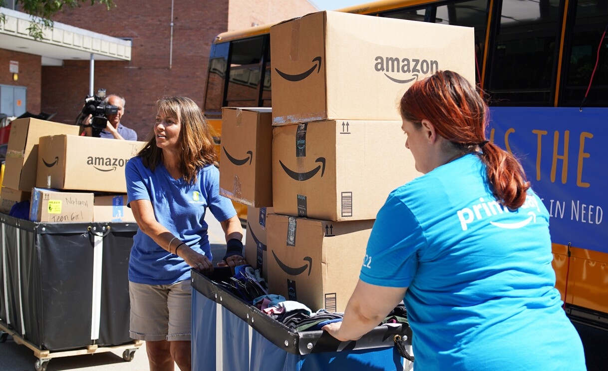 Amazon employees surprise nonprofits and schools with donations of various items.