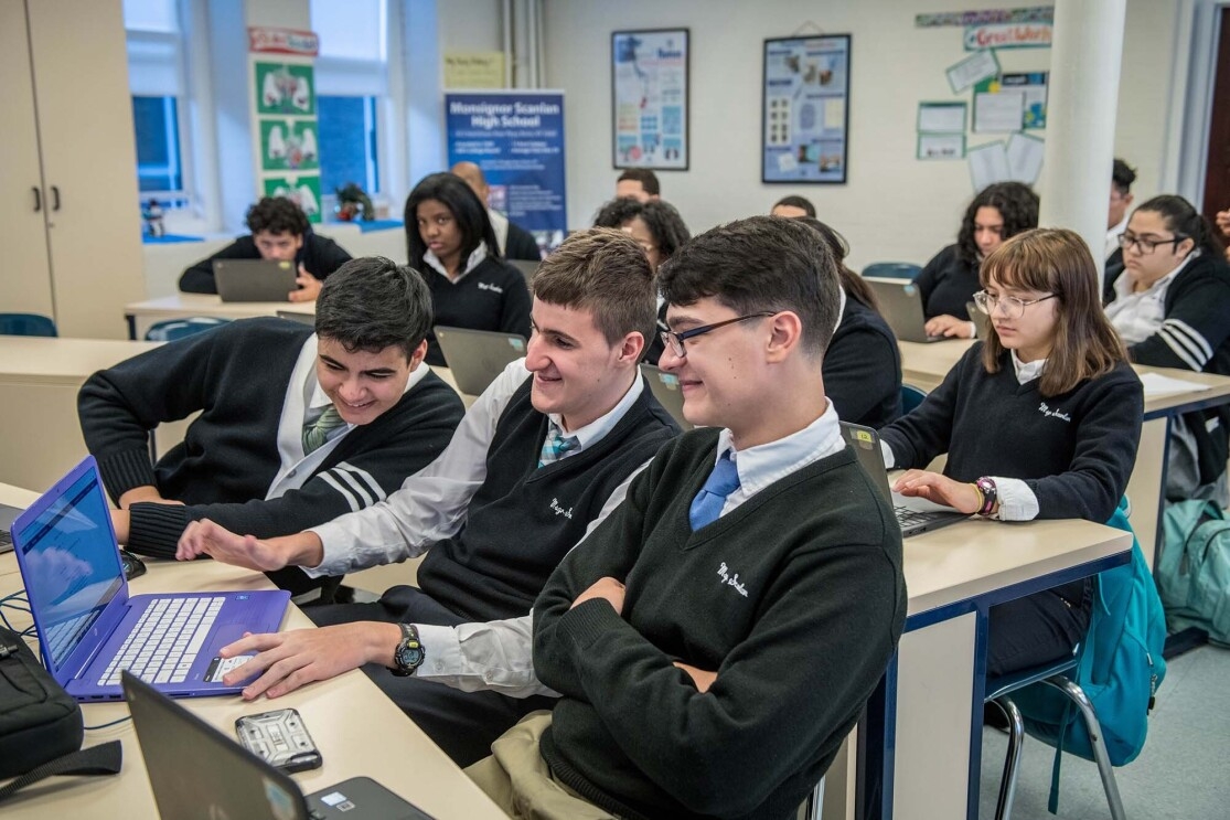 Students at Monsignor Scanlan High School working on laptop computers as they learn about computer science.