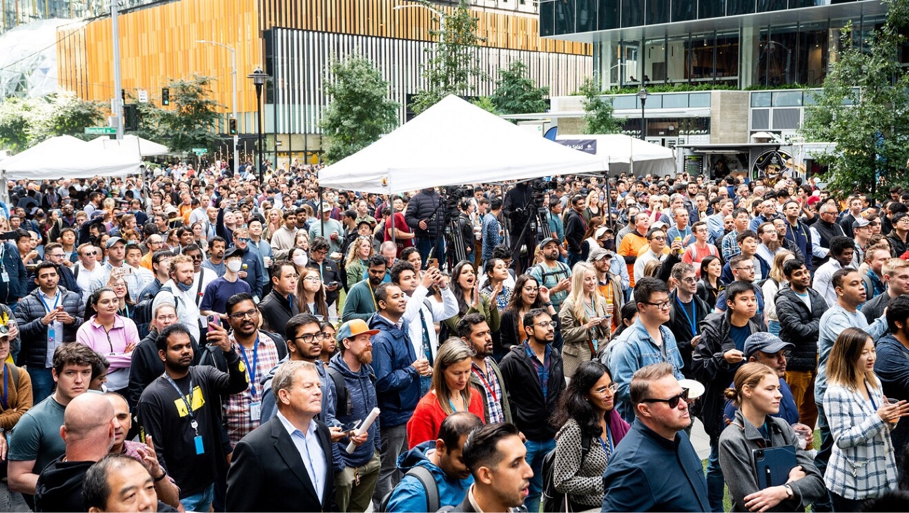 An image of a group joining together at the Amazon Web Services event at Amazon's headquarters in Seattle