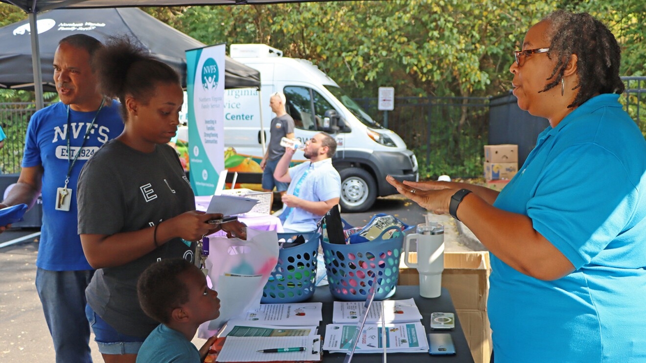 A photo of Northern Virginia Family Service (NVFS) and Amazon Web Services (AWS) hosting a food distribution pop-up event.