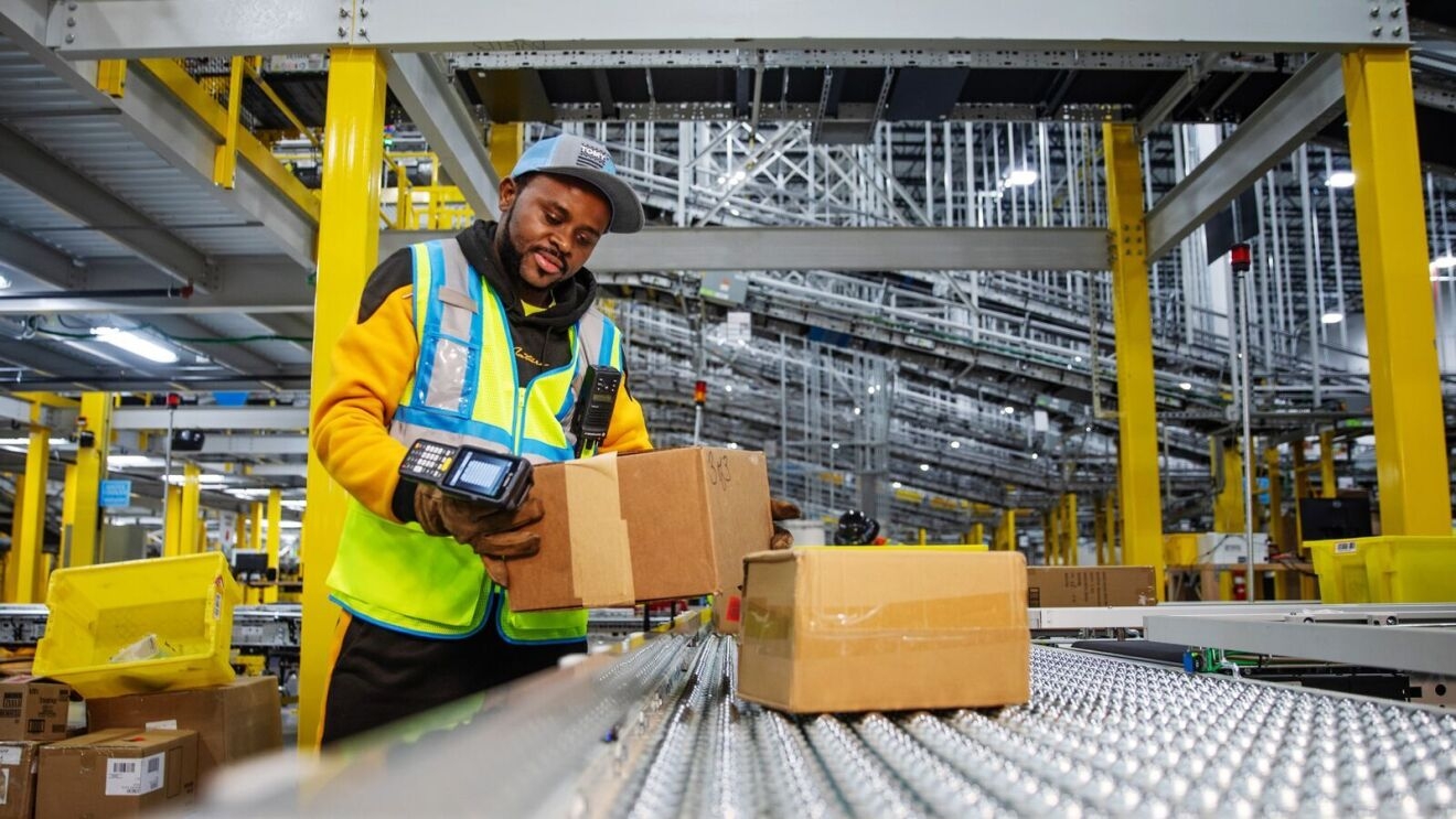 portraits and environmental photos of abel tuyisenge, a transportation operations management associate at amazon, as he drives and inspects trucks