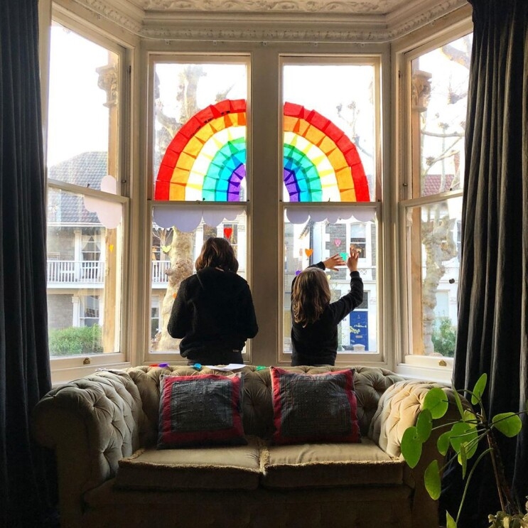 Rainbows displayed in windows, created by children, as a means to thank essential workers during the COVID-19 pandemic