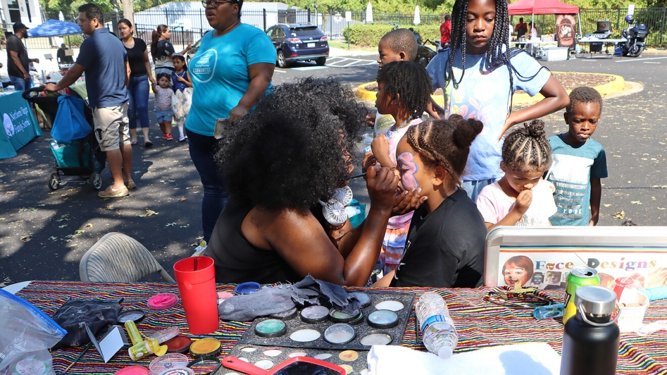 A photo of Northern Virginia Family Service (NVFS) and Amazon Web Services (AWS) hosting a food distribution pop-up event.