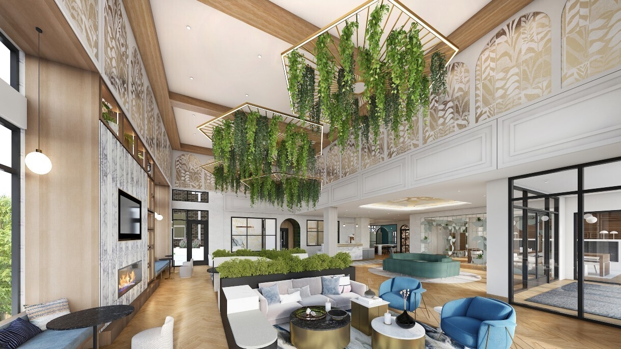 The Margaux lobby has a few seating areas and greenery hanging from the ceiling.