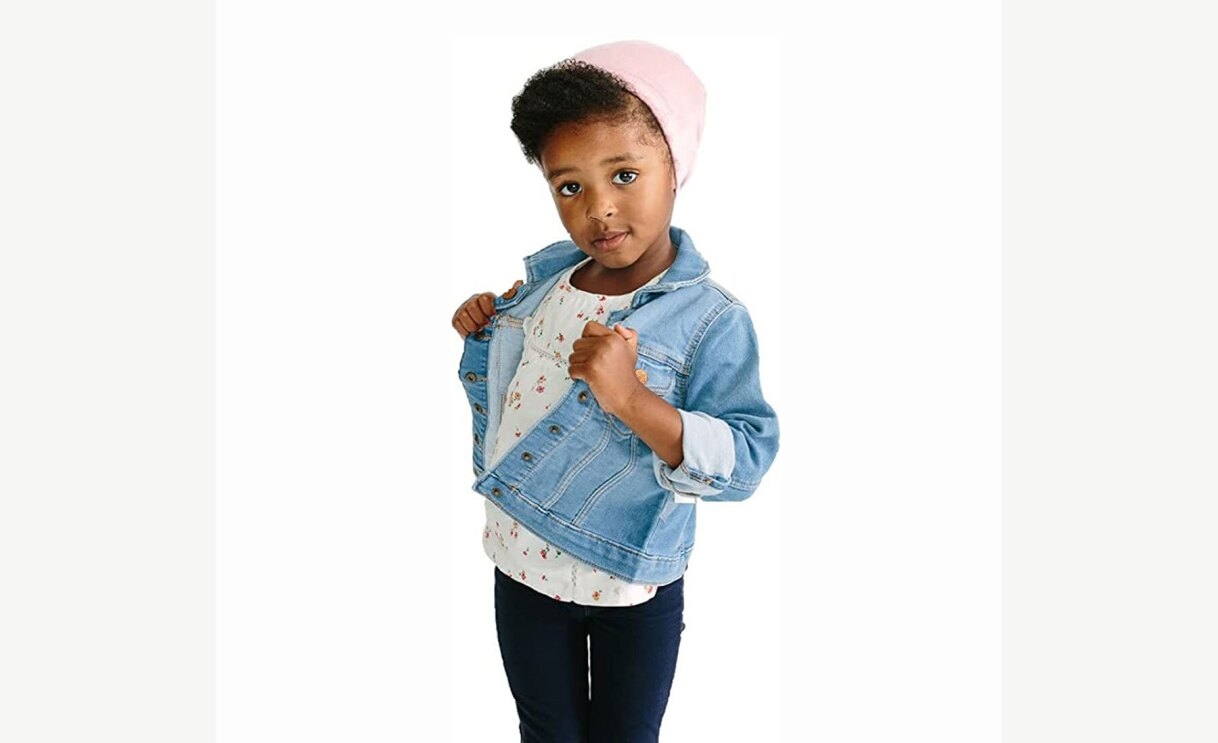 Child wearing a pink Grace Eleyae satin lined cap.