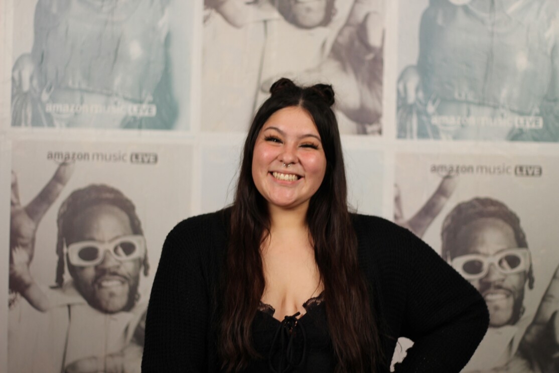 An image of Ima Faith Hernandez smiling for a headshot photo