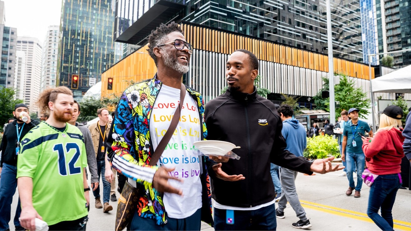 An image of a group joining together at the Amazon Web Services event at Amazon's headquarters in Seattle