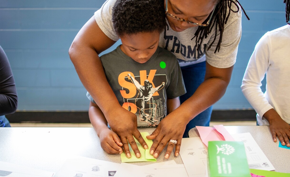 Amazon employees surprise nonprofits and schools with donations of various items.