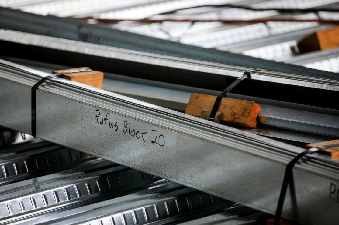 Buildings under construction on Amazon's South Lake Union campus. a beam with "Rufus Block 20" scribed on it. 