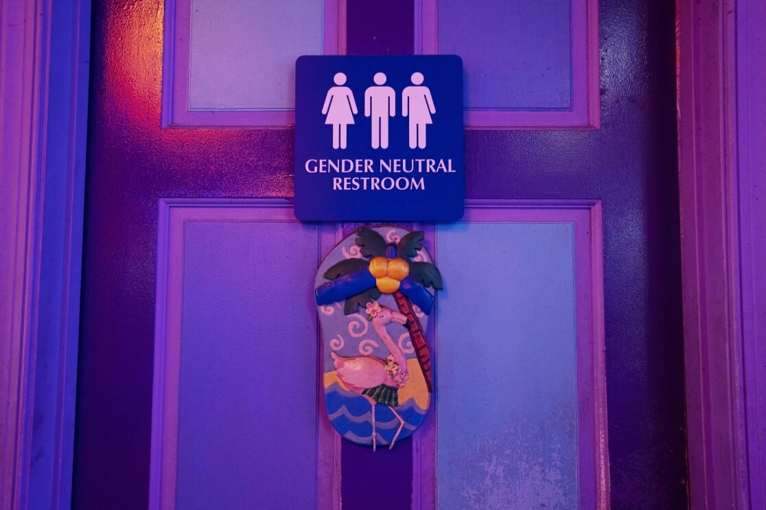 A door with a sign reading "gender neutral restroom."