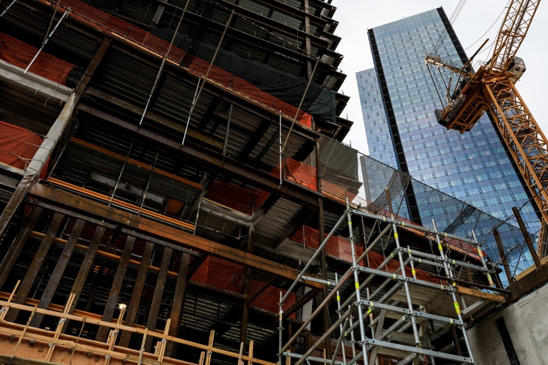 Buildings under construction on Amazon's South Lake Union campus. A crane and temporary supports are shown in the image.