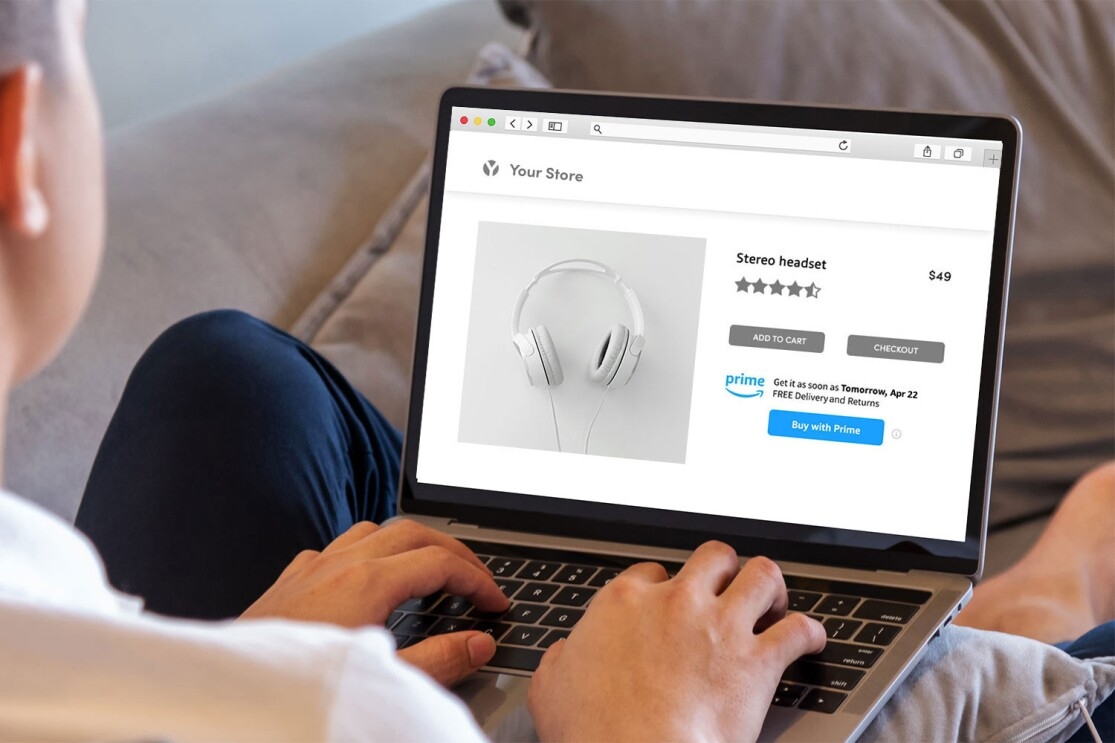 A laptop showing a screen where someone is using Amazon's new "Buy it with Prime" feature to purchase headphones. 