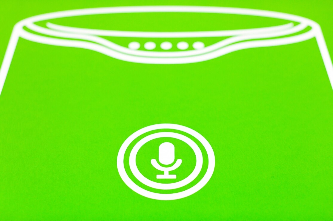 A line drawing of the mute button on an Amazon Echo. The background is green and the line drawing is white. 