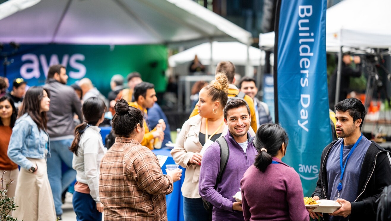 An image of a group joining together at the Amazon Web Services event at Amazon's headquarters in Seattle