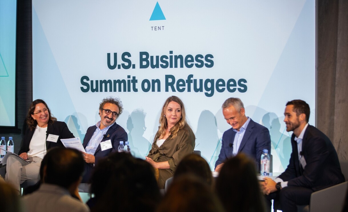 Janet Saura, VP of Employee Relations, and four other panelists discussing Amazon's hiring commitment at the U.S. Business Summit on Refugees.