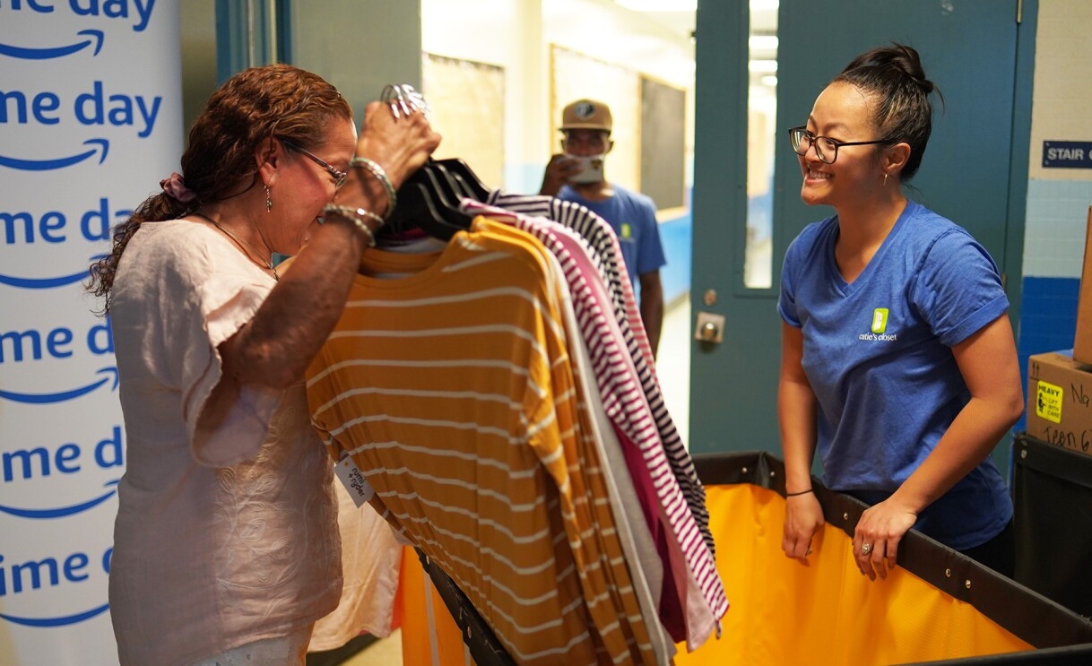 Amazon employees surprise nonprofits and schools with donations of various items.