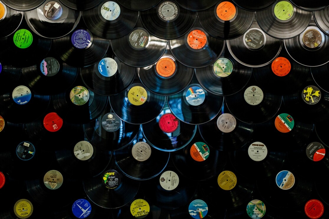 An array of vinyl records shot from above. 