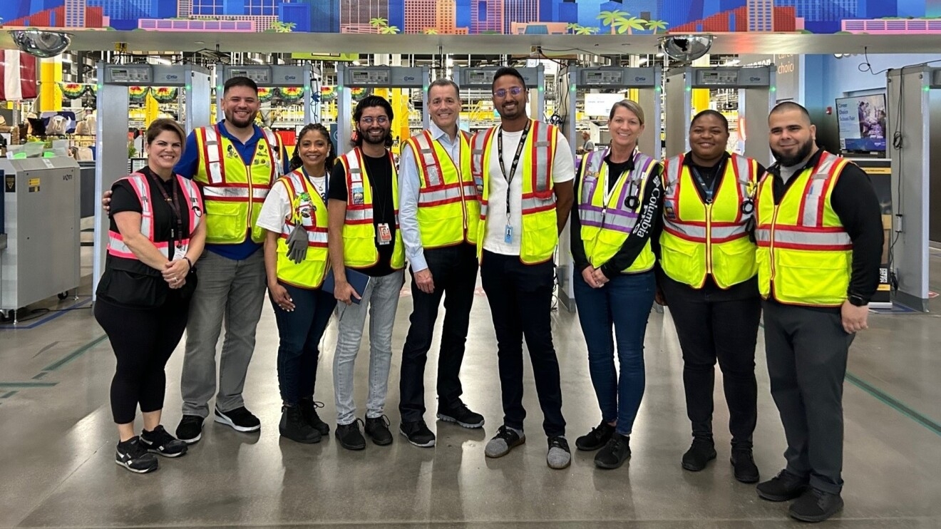 Doug Herrington poses with Amazon employees