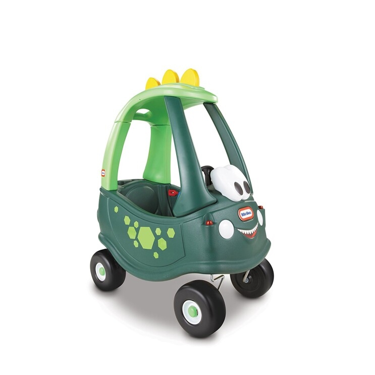 A Little Tikes Cozy Coupe children's ride-on car, in an exclusive dinosaur design, with a dino spine on the roof, green body, and large eyes.