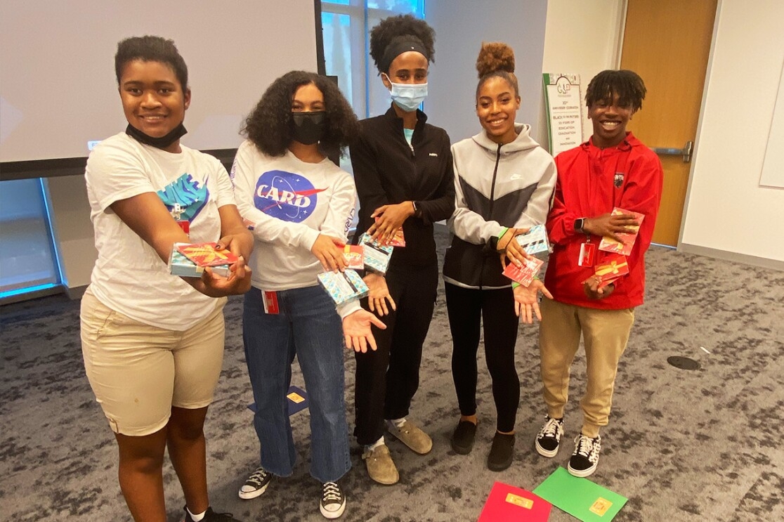  An image of Amazon's Greene Scholars Program participants showing their prizes. 