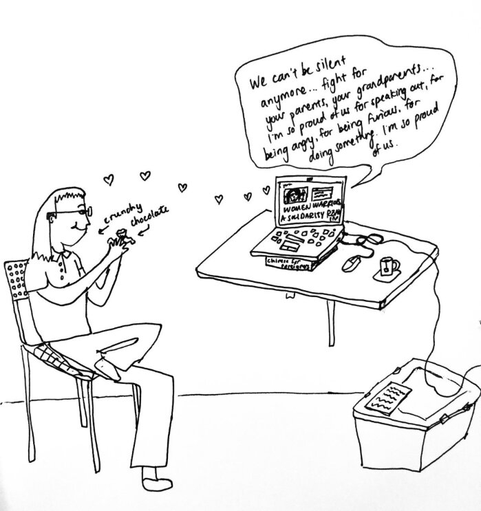 An illustration showing a woman at her desk looking at her computer while eating chocolate. There is a word bubble coming from the computer that says, "we can't be silent anymore... fight for your parents, your grandparents... I'm so proud of us for being furious. For doing something. I'm so proud of us."
