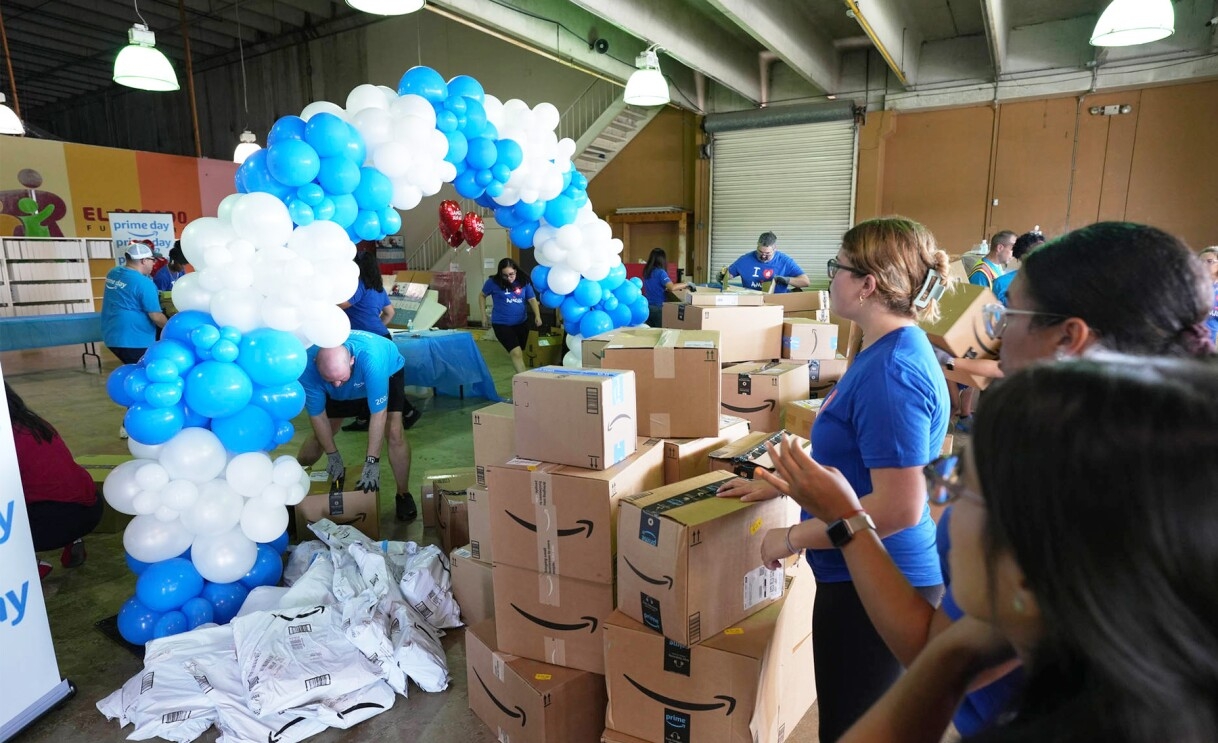 Amazon employees surprise nonprofits and schools with donations of various items.